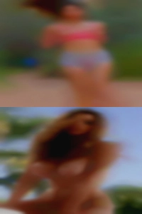 (holding naked woman the camera.